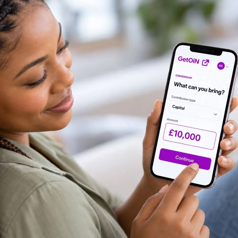 Woman tapping a phone showing GetOiN Ownership: What can you bring? Capital, £10,000