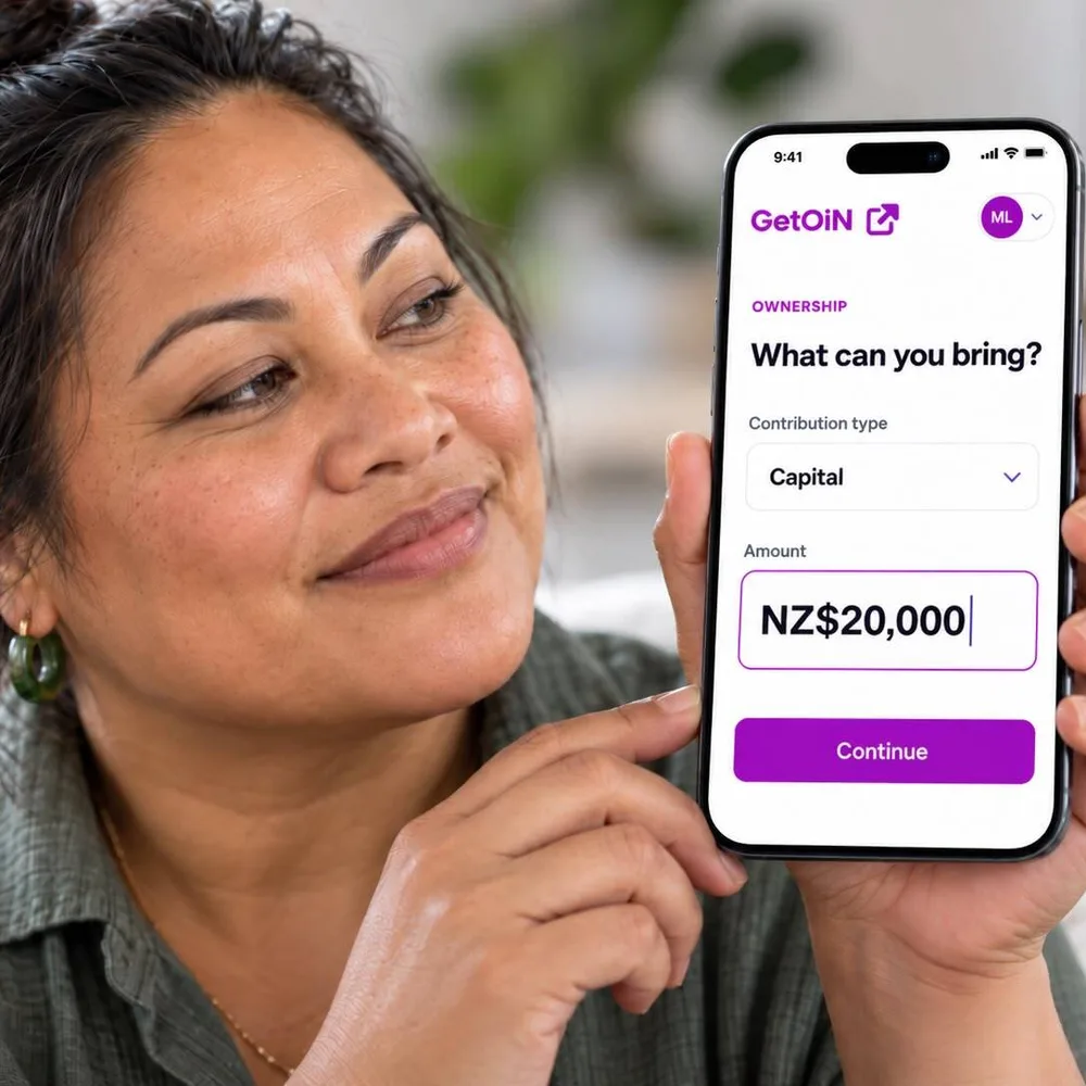 Woman holding a phone showing GetOiN Ownership: What can you bring? Capital, NZ$20,000