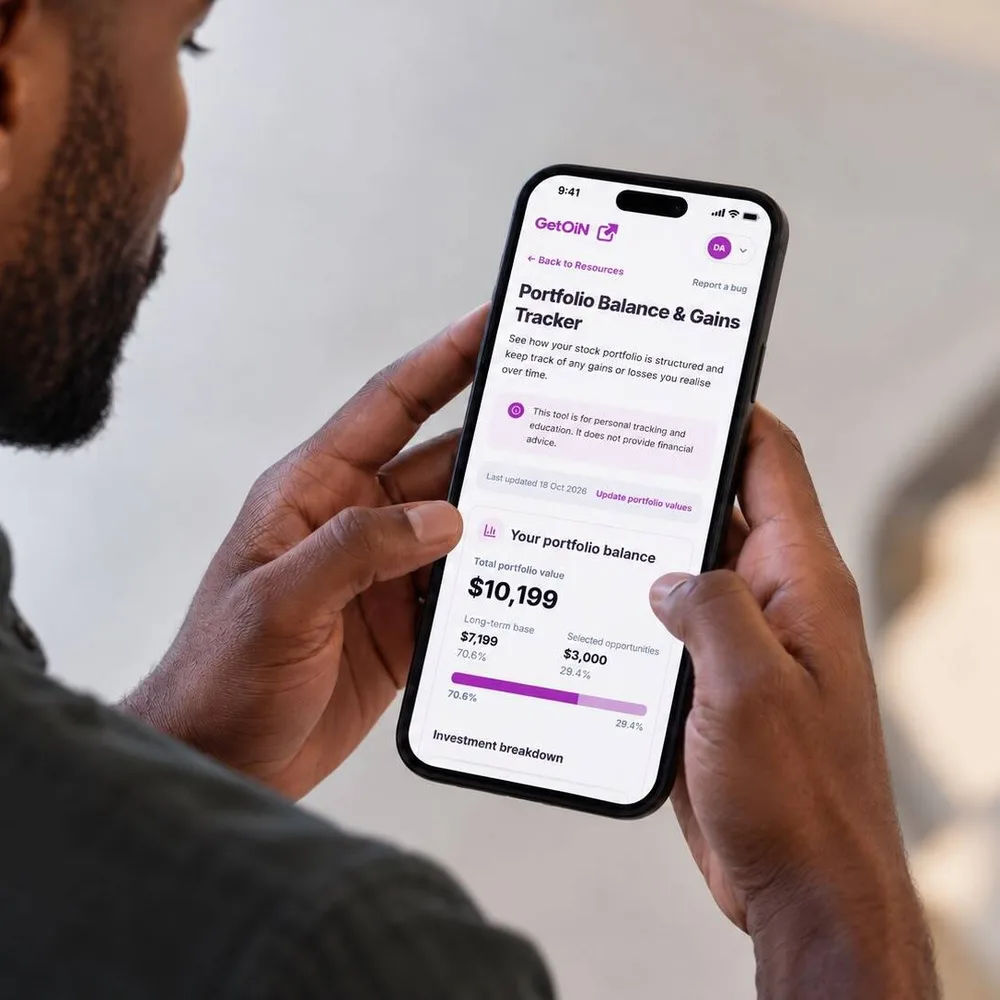 Man holding a phone showing the GetOiN Portfolio Balance & Gains Tracker with a US$10,199 portfolio